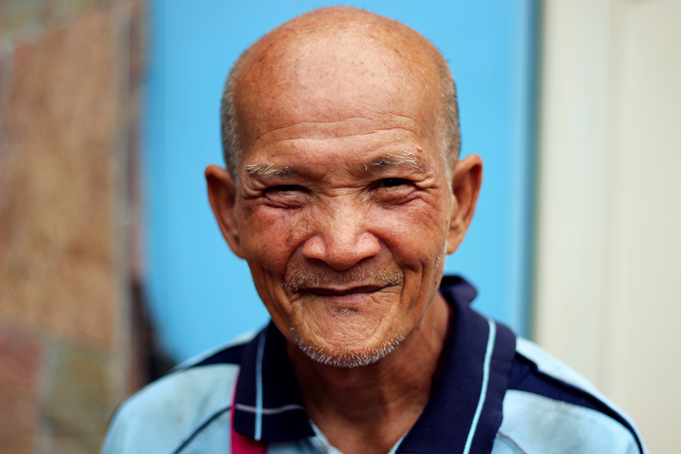 Cute smiling older Asian man
